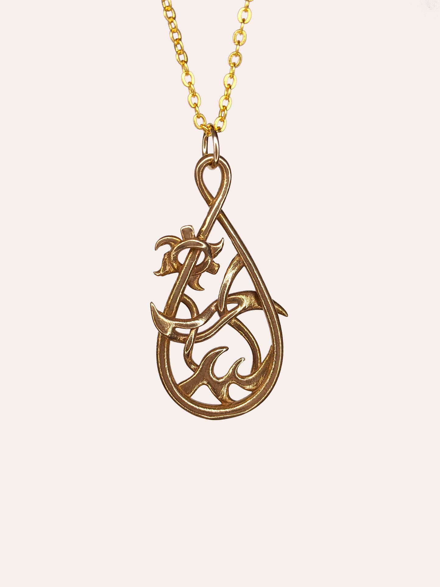 Bronze teardrop pendant with waves at bottom, a reversed tilde in the center, and a gear-like sun on the upper left.