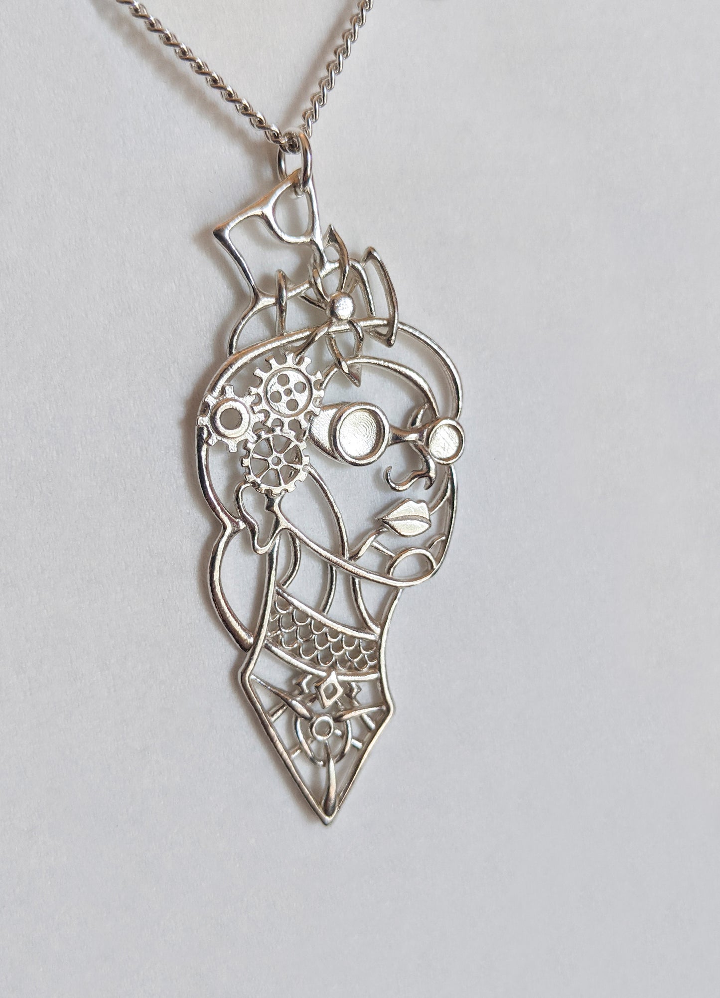 Victoria pendant in silver against a light background.